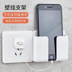 Dụng cụ để điện thoại, remote có khe dây sạc dán tường